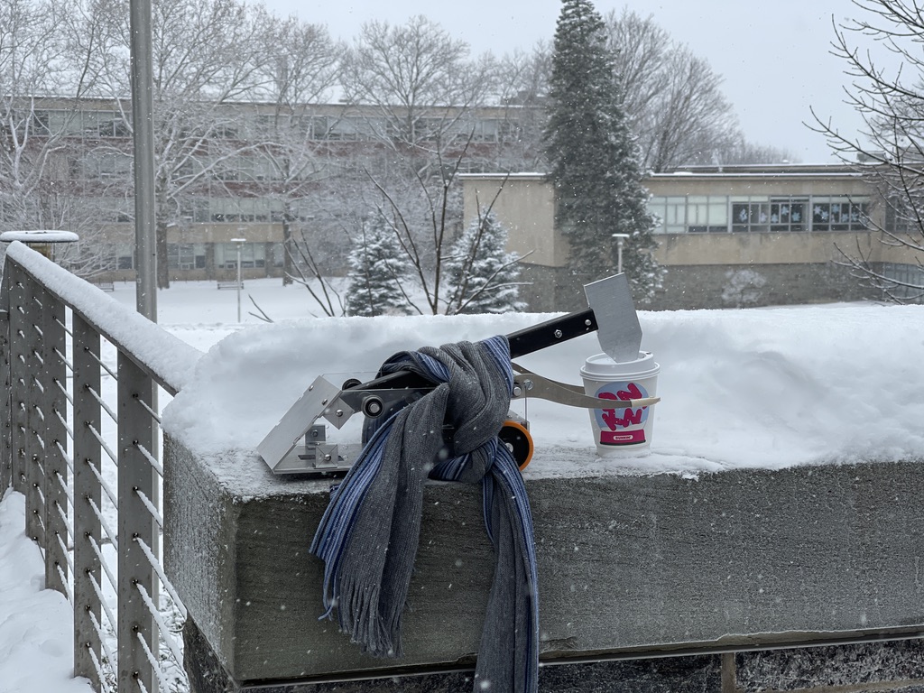 Manny enjoys a beverage in the snow