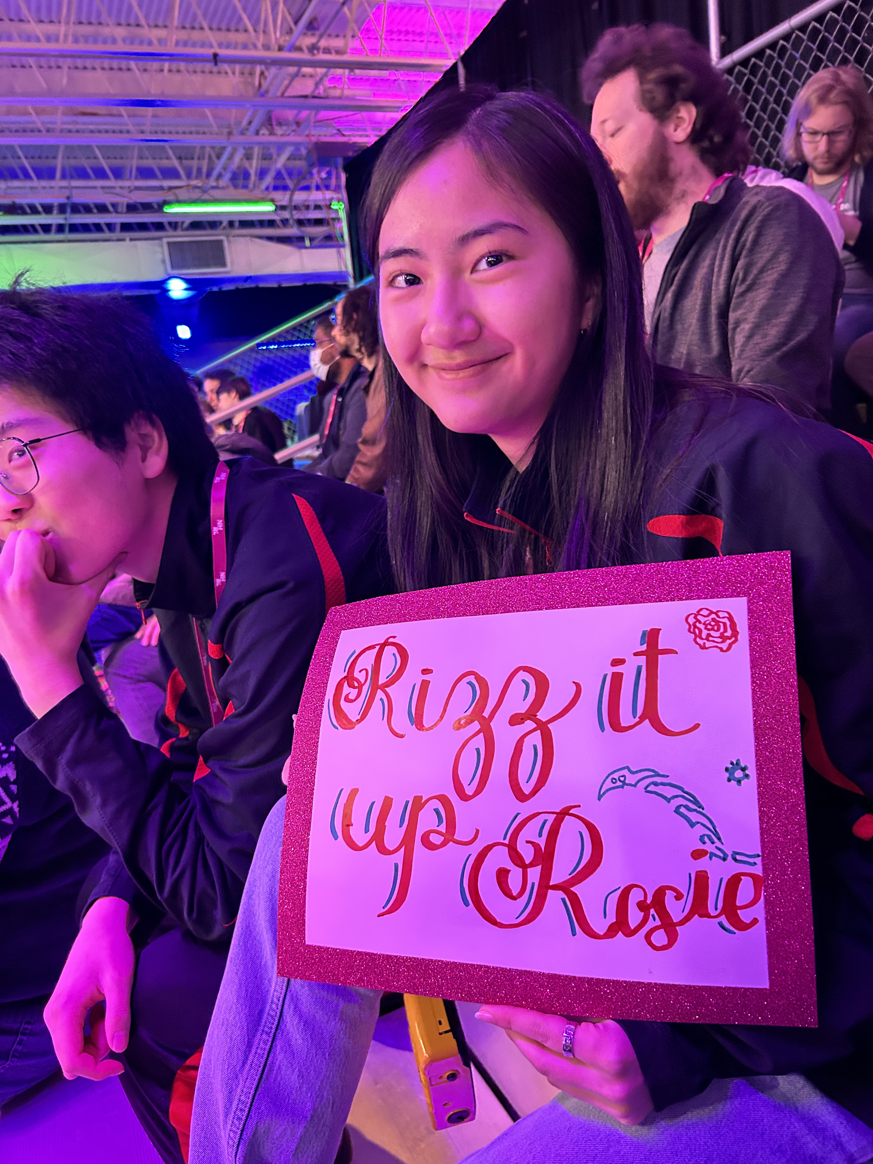 Grace holding up a sign supporting Rosie